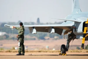Pilot performing a pre-flight inspection